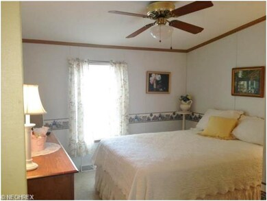 Guest suite with picturesque pergola view is locat
