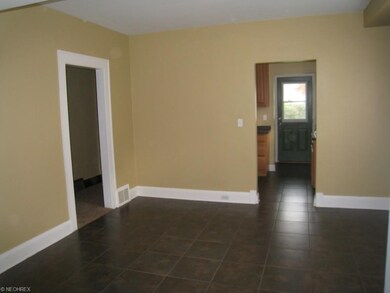 Dining room looking into the kitchen and back door