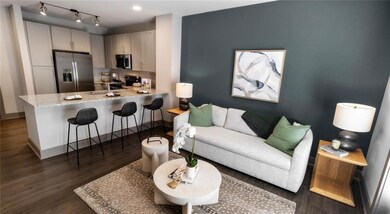 Living room featuring track lighting, dark hardwoo
