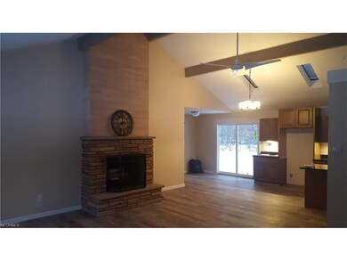 Open floor plan looking through living room to kit