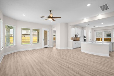 Unfurnished living room featuring light wood-styl