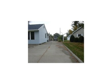 Front Exterior. extra parking pad