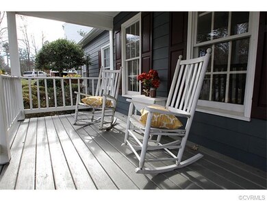 Country front porch with gorgeous flower boxes wit