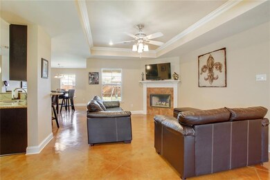 LIVING ROOM HAS A CROWNED 10' TRAY CEILING WITH A