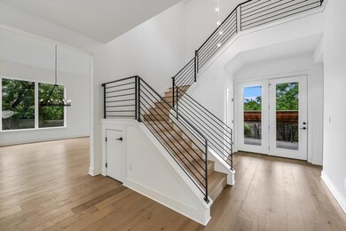 Staircase featuring plenty of natural light, a ch