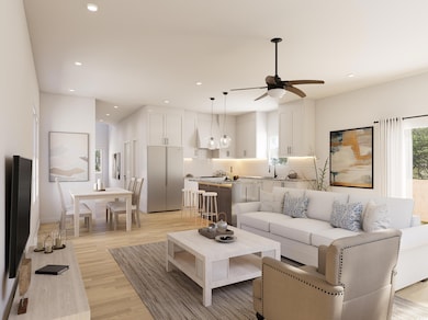 Living area with light wood-style flooring, recessed lighting, and a ceiling fan