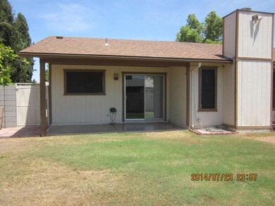 VIEW OF COVERED PATIO FROM YARD