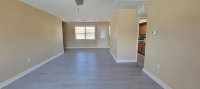 Empty room featuring ceiling fan and hardwood / wo