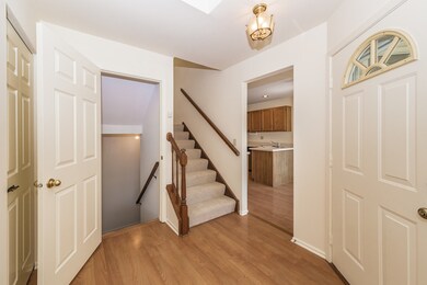 NICE SIZE FOYER! VIEW LOOKING INTO THE KITCHEN AND