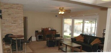 LR w/handsome stone FP & ceiling fan