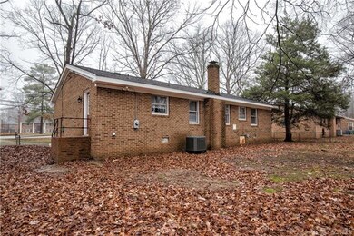 Spacious rear fenced yard.