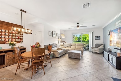 Living room featuring light tile patterned floors,