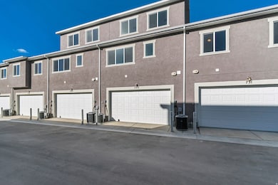 Rear view of house featuring stucco siding