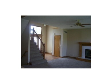 Foyer w/hardwoods, staircase to second floor, fire