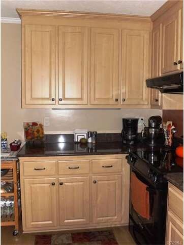 The refaced kitchen cabinets are a beautiful color