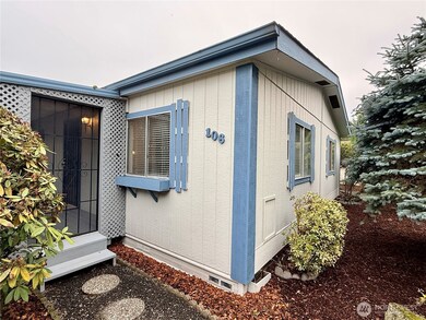 Nice landscaping and pathway leading to the covered front porch.