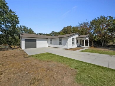 View of front of property with a front yard and a 