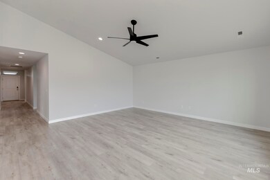 Unfurnished room with light wood-type flooring, recessed lighting, lofted ceiling, and a ceiling fan