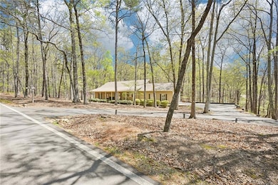 View of front facade featuring a wooded view