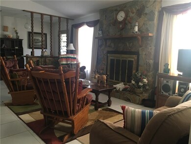 Stone Wood Burning Fireplace in Living Room