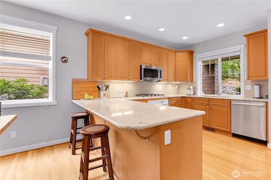 Quartz countertops also wrap around the kitchen, and there’s quartz dining bar which is a nice gathering place.