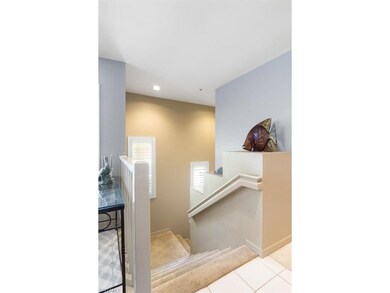 Stairway to front door and to the attached garage.
