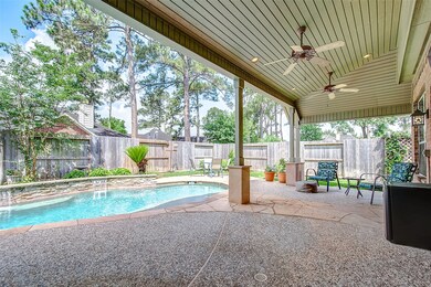A private pool and covered patio will make for year round entertainment.  Ceiling fans keep you cool while watching tv outside or swimming in your pool with relaxing  fountains.  The gardens add color to your backyard oasis.