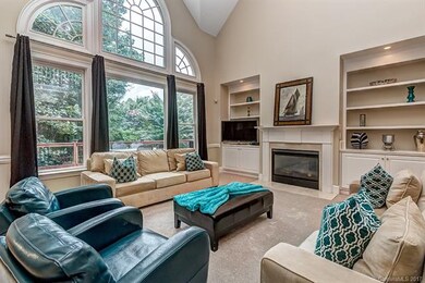 Two-story great room overlooks the backyard and fe
