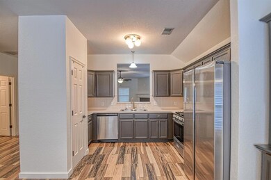 Kitchen featuring tasteful backsplash, visible ven