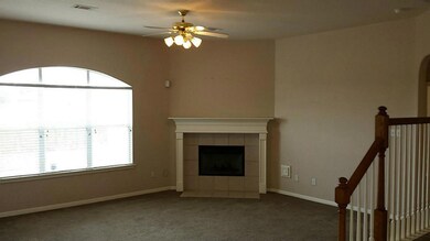 Living room with gas fireplace.