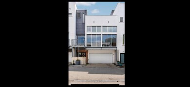 View of front facade featuring concrete driveway 