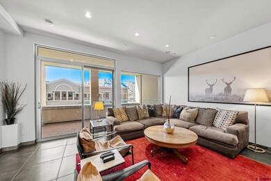 Tiled living area featuring recessed lighting and 