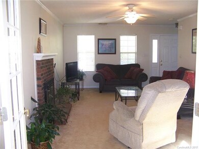 Living room with wood burning fireplace