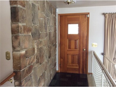 Beautiful Rock Wall and Slate Floor Foyer!