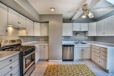 The kitchen  offers new stainless appliances, vaul