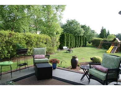 Raised patio with brick edge trim and lower aggreg