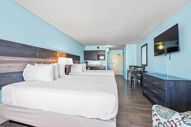 Bedroom with dark wood-type flooring