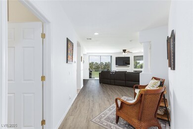 Hallway with light wood-type flooring, decorative
