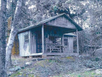 Exterior Front. Existing rustic...