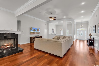 Living room featuring a ceiling fan, recessed ligh