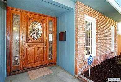 Beautiful front entry door and used brick front of