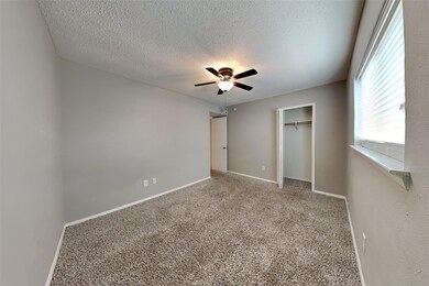 Spare room featuring a textured ceiling, ceiling f