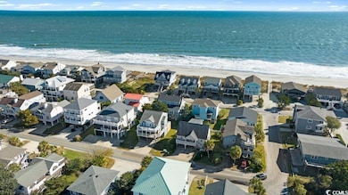 Bird's eye view with a water view and a view of th