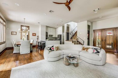 Living room with a chandelier, wood finished floo