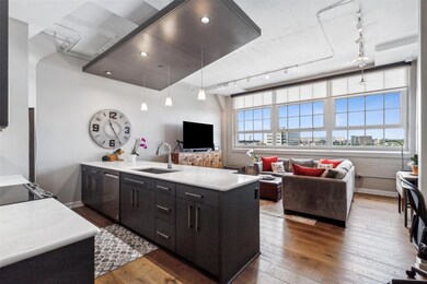 Kitchen with sink, rail lighting, pendant lighting