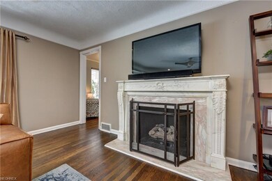 Intricate marble fireplace. Doorway to library