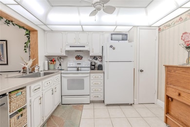 It also features a new extra large stainless steel ice maker, and ample cabinets featuring unique utensil hardware.