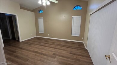 Unfurnished room featuring high vaulted ceiling, c