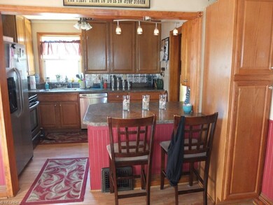 Kitchen has a breakfast bar and pantry.