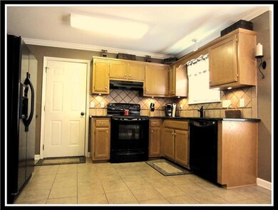 Newly Remodeled Kitchen with Tile, Granite, & Appliances.